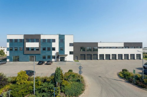 Projekt budynku handlowego z częścią warsztatowo magazynowo biurową K-147, piętrowy, bez podpiwniczenia i bez garażu - wizualizacja elewacji