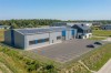 Projekt budynku usługowego z częścią magazynową K-153, Część biurowa / usługowa - podpiwniczona, część magazynowa - niepodpiwniczona  - wizualizacja elewacji lewej