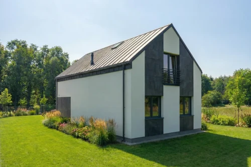 Projekt domu Rista DM-6854, parterowy z poddaszem użytkowym, bez podpiwniczenia, bez garażu - wizualizacja elewacji ogrodowej