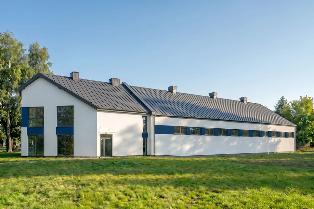 Projekt budynku biurowo - magazynowego LK-175, dwukondygnacyjny budynek biurowy, jednokondygnacyjna hala magazynowa - wizualizacja elewacji prawej