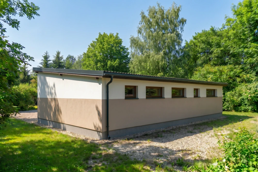 Projekt budynku gospodarczo-garażowego ZG-24, parterowy, niepodpiwniczony, z garażem - wizualizacja elewacji ogrodowej